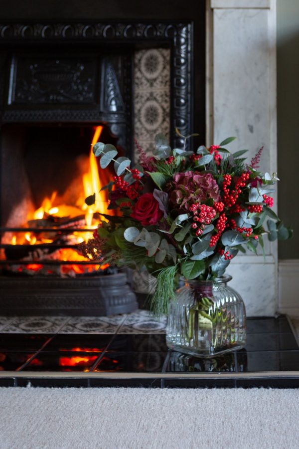 Red Mixed Bouquet By Fireplace