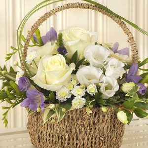 White And Purple Bouquet Displayed In A Basket