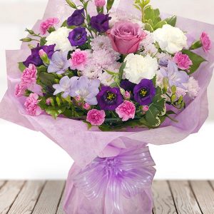 Purple Pink And White Bouquet In A Pink Gift Container