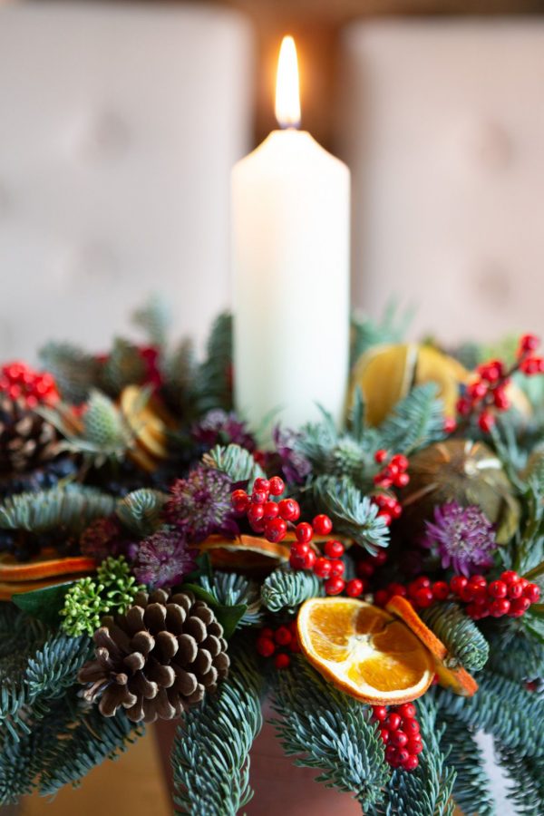 Table Arrangement Featuring Dried Oranges And Berries Close Up