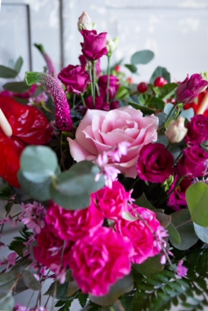 Pink And Red Bouquet With Green Foliage Close Up